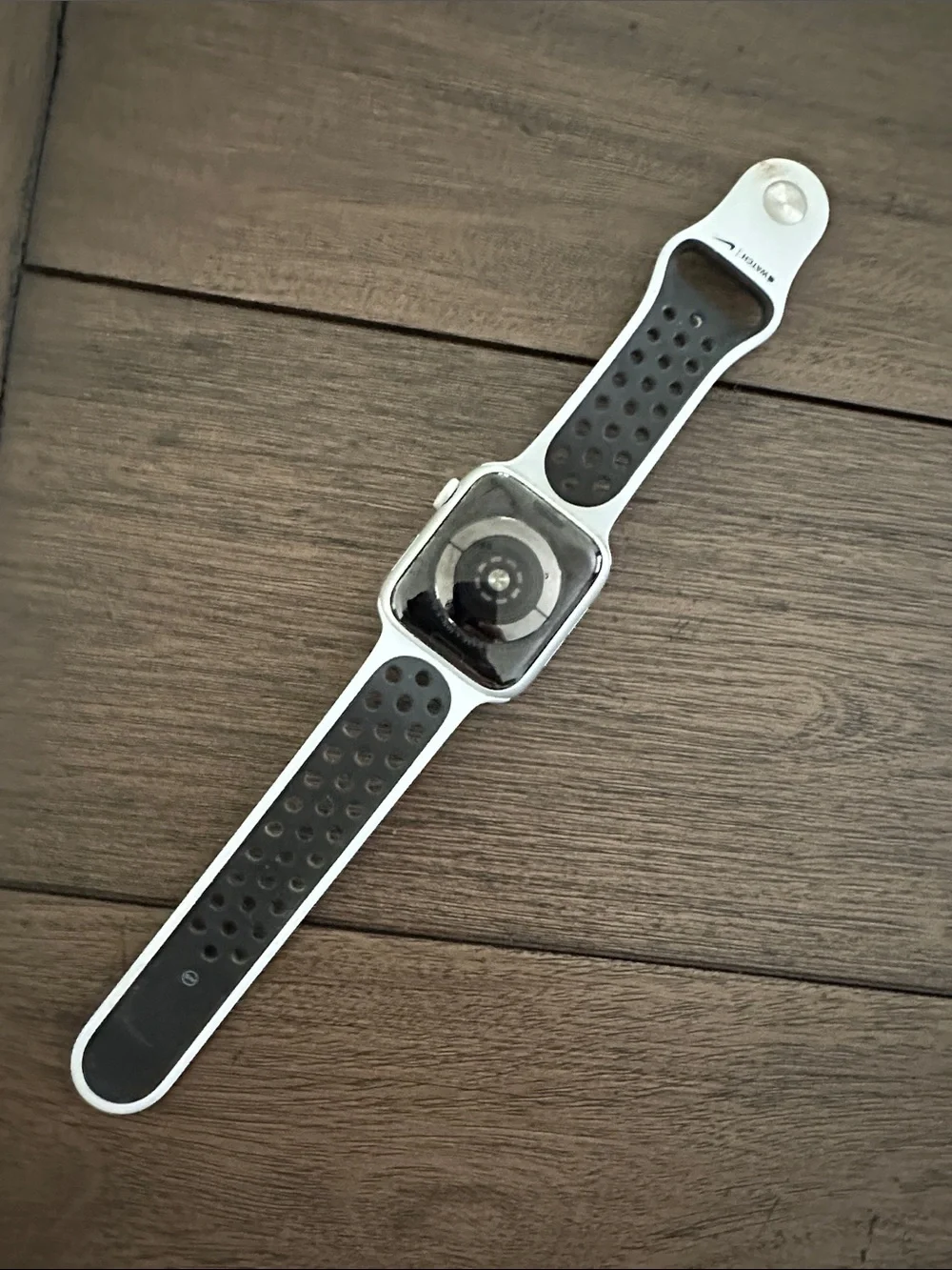 Apple Watch with White Perforated Sport Band. Nike addition series 5